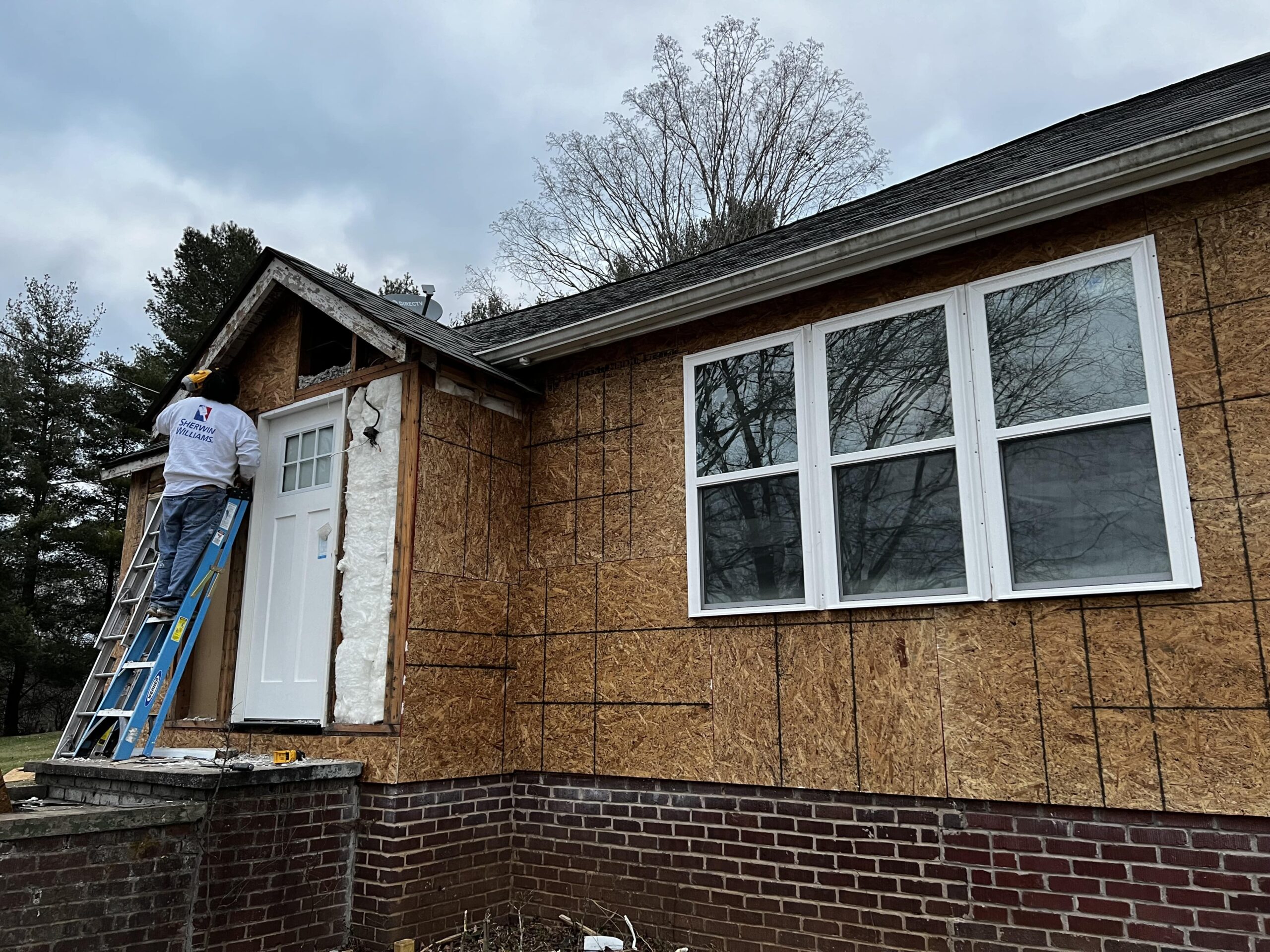 RM & Sons siding contractor repairing sheathing for siding installation