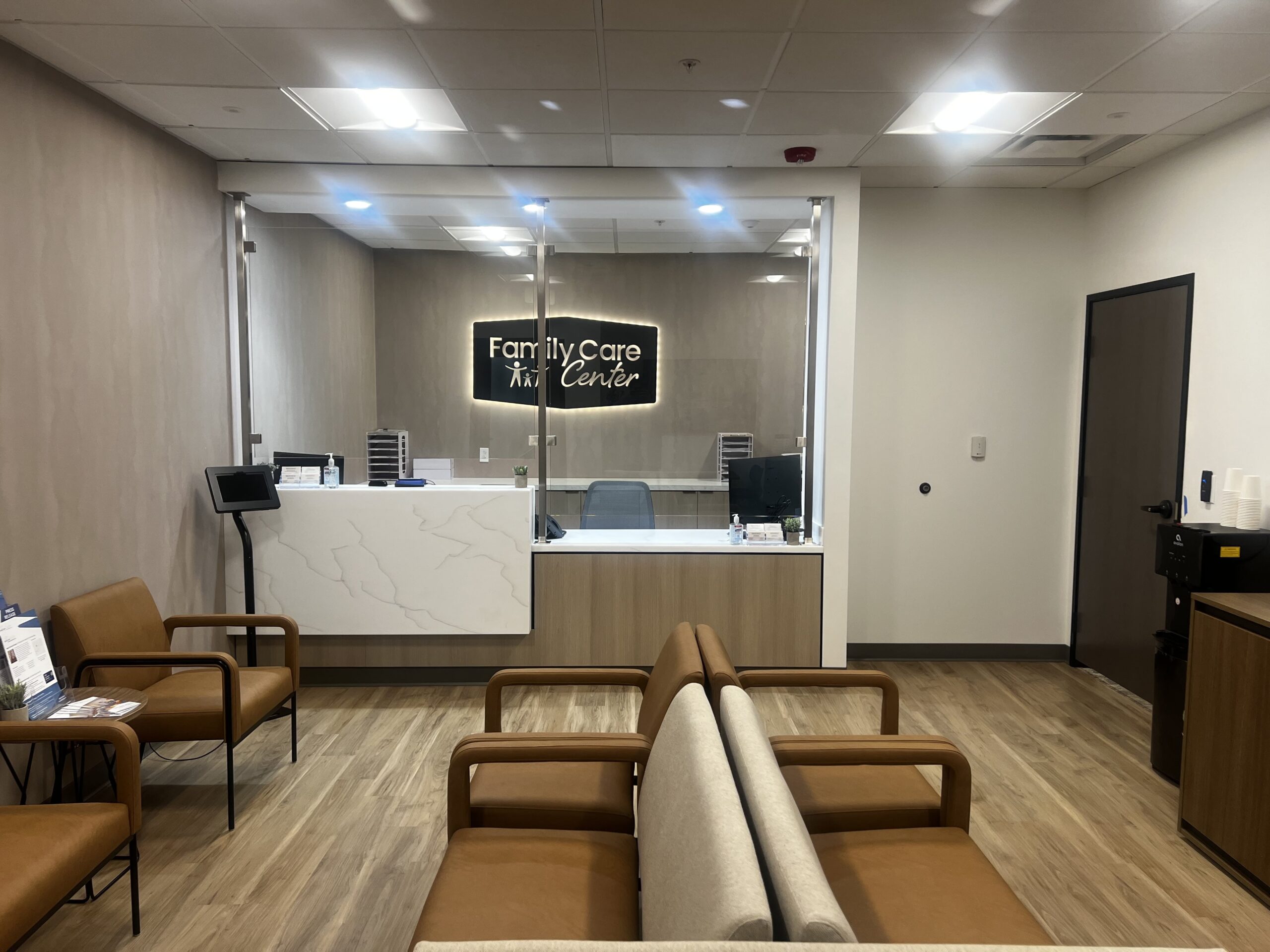 Waiting area and reception of Family Care Center, beautifully painted by RM & Sons Painting's skilled commercial painters, highlighting their expertise in office painting